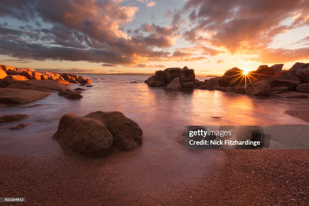 Sunset over a secluded beach in Coles Bay, Freycinet national Park, Tasmania, Australia
