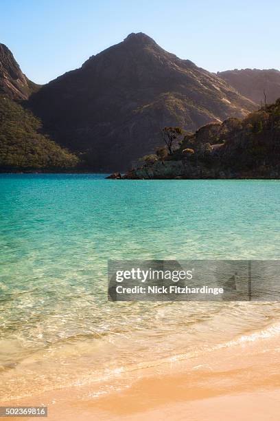 the turquoise waters of wineglass bay gleaming in the sun, freycinet national park, tasmania, australia - wineglass bay stock pictures, royalty-free photos & images