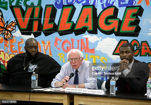 Rapper Killer Mike, left, and State Representative La Shawn Ford , right, listen as Democratic presidential candidate U.S. Senator Bernie Sanders,...
