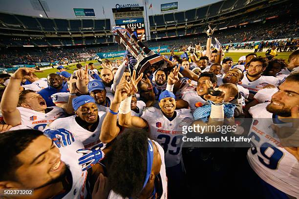 The Boise State Broncos celebrate the win over the Northern Illinois Huskies in the San Diego County Credit Union Poinsettia Bowl on December 23,...