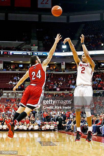 Marc Loving of the Ohio State Buckeyes shoots the ball over Michael Orris of the Northern Illinois Huskies during the game at Value City Arena on...