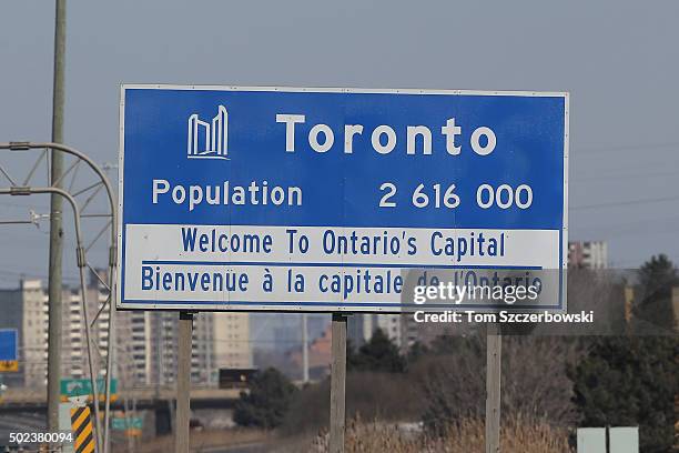 City sign along the eastbound 401 highway announcing the population of Toronto on March 9, 2015 in Toronto, Ontario, Canada.