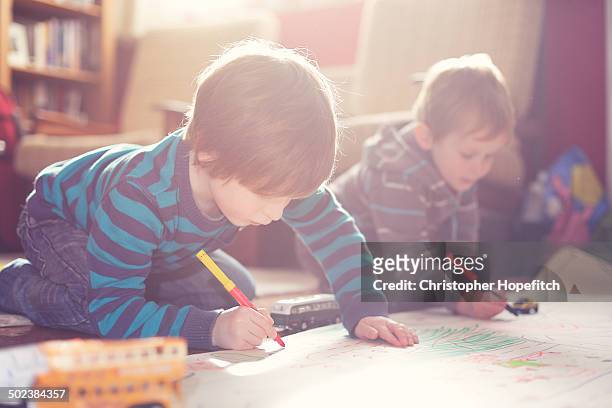 young brothers drawing - drawing stock pictures, royalty-free photos & images