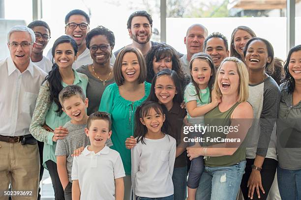 multi-generational family standing together - live in levis event stock pictures, royalty-free photos & images