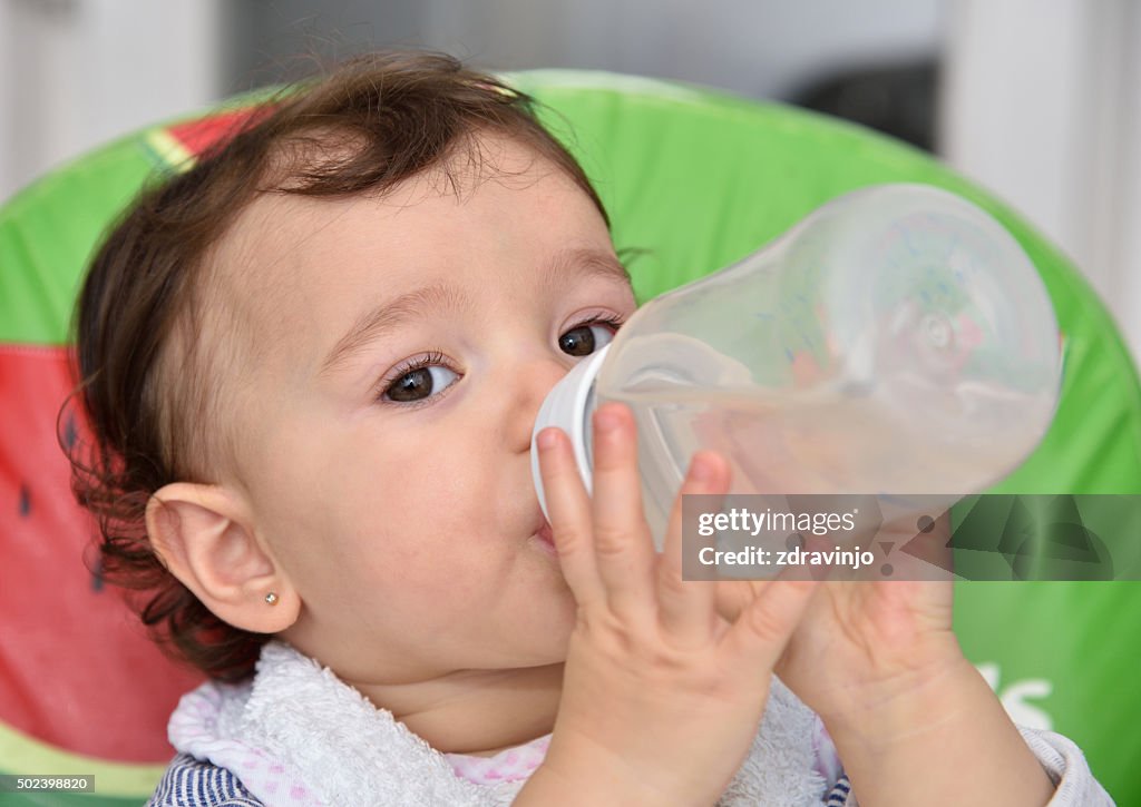 Baby girl drinking water