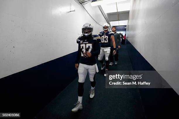 Eric Weddle of the San Diego Chargers and John Phillips of the San Diego Chargers walk through a tunnel to the stadium prior to a game against the...