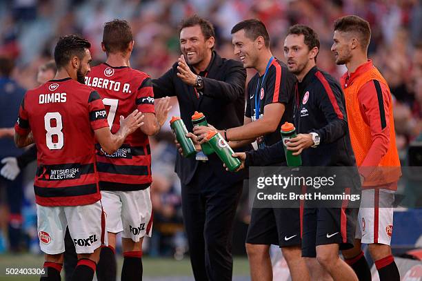 Alberto Aguilar of the Wanderers celebrates scoring a goal with Tony Popovic, coach of the Wanderers, during the round 12 A-League match between the...