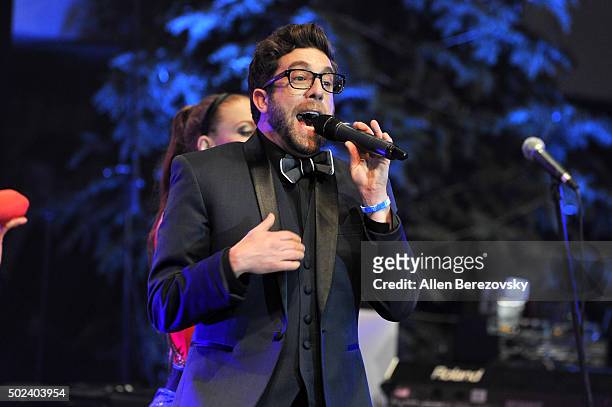 Singer Elliott Yamin performs onstage during the OC Christmas Extravaganza Concert and Ball at Christ Cathedral on December 23, 2015 in Garden Grove,...