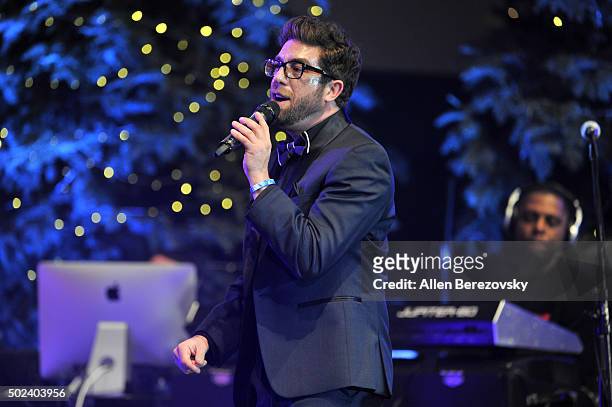 Singer Elliott Yamin performs onstage during the OC Christmas Extravaganza Concert and Ball at Christ Cathedral on December 23, 2015 in Garden Grove,...