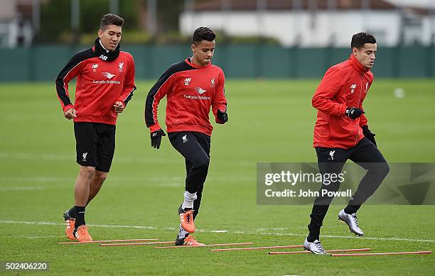 Roberto Firmino, Allan Rodrigues de Souza and Philippe Coutinho of Liverpool during a training session at Melwood Training Ground on December 24,...