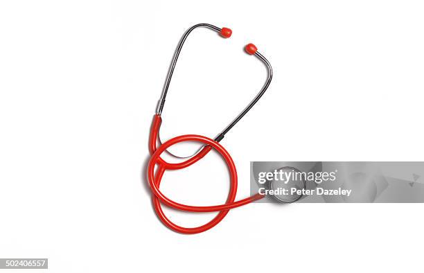 red stethoscope with copy space - stethoscope stockfoto's en -beelden