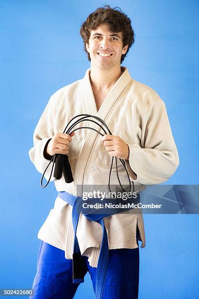 martial arts student portrait with skipping rope - blue belt stock pictures, royalty-free photos & images