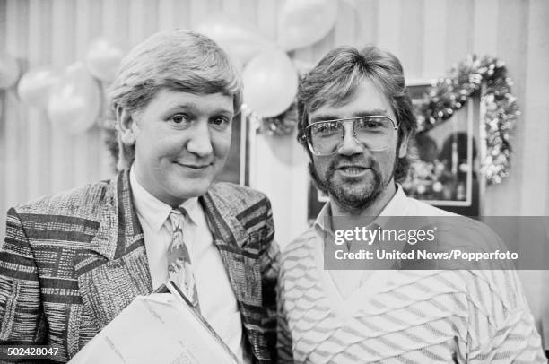 English radio and television presenters Mike Smith and Noel Edmonds pictured at a BBC press call in London on 5th December 1985.