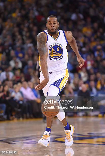 Andre Iguodala of the Golden State Warriors dribbles the ball against the Utah Jazz during their NBA basketball game at ORACLE Arena on December 23,...