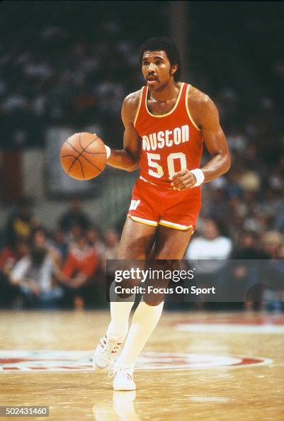 Robert Reid of the Houston Rockets dribbles the ball against the New