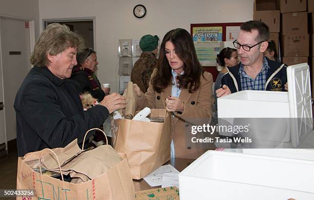 Restaurateurs Ken Todd and wife Lisa Vanderpump package holiday meals for delivery to Project Angel Food clients at Project Angel Food on December...