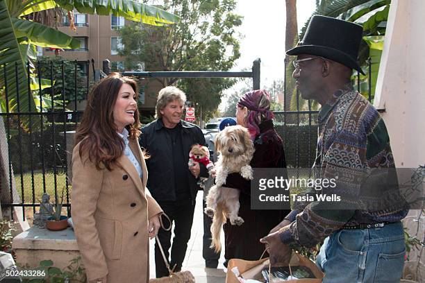 Restaurateurs Lisa Vanderpump and husband Ken Todd deliver holiday meals to Project Angel Food clients on December 24, 2015 in Los Angeles,...
