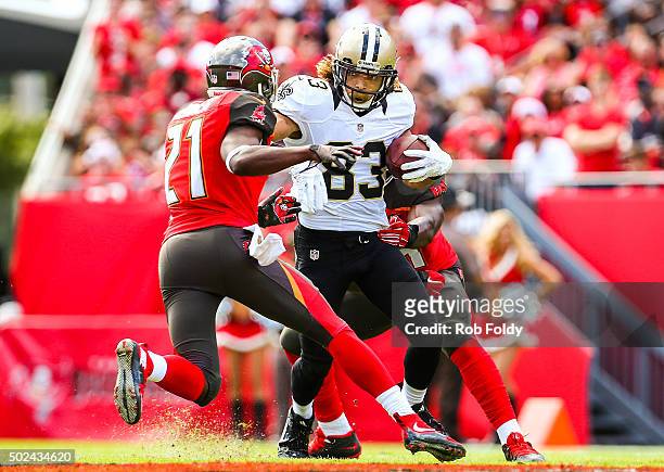 Willie Snead of the New Orleans Saints is defended by Alterraun Verner of the Tampa Bay Buccaneers during the game at Raymond James Stadium on...