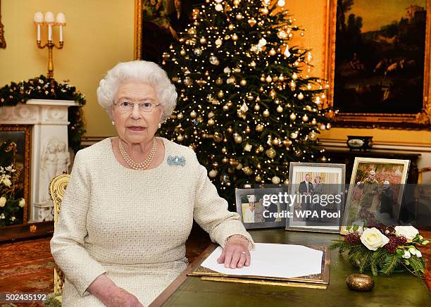 Queen Elizabeth II sits at a desk in the 18th Century Room at Buckingham Palace, after recording her Christmas Day broadcast to the Commonwealth on...
