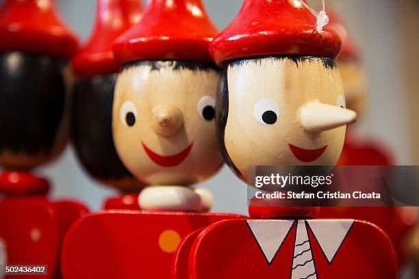 pinocchio figures in rome - pinocchio stock pictures, royalty-free photos & images