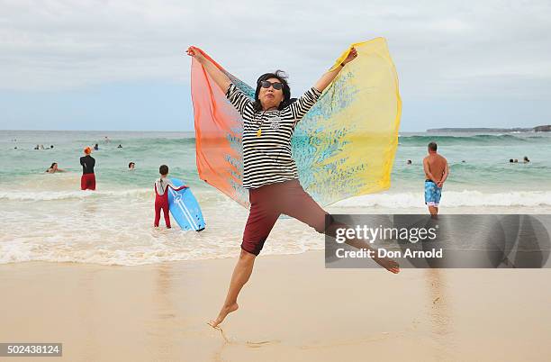 A woman from Shanghai, China, poses at Bondi Beach on December 25, 2015 in Sydney, Australia. Bondi Beach is a popular tourist destination on...