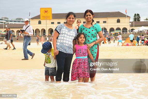 The Alepi family from Hydrabad, India, pose at Bondi Beach on December 25, 2015 in Sydney, Australia. Bondi Beach is a popular tourist destination on...