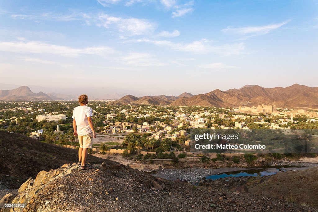 Tourist looking at landscape around Bahla