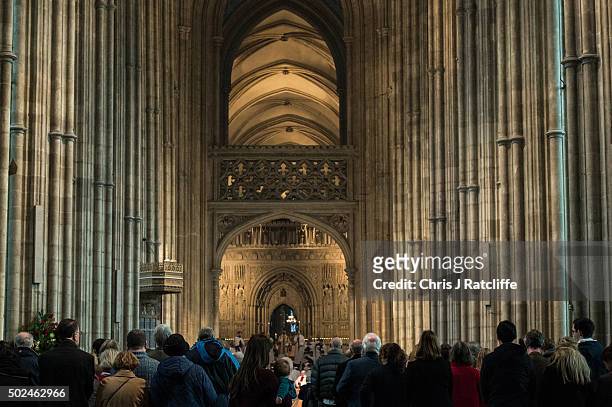 Mother and her child look on as the Archbishop of Canterbury, Justin Welby, holds communion and delivers his Christmas Day sermon to the congregation...