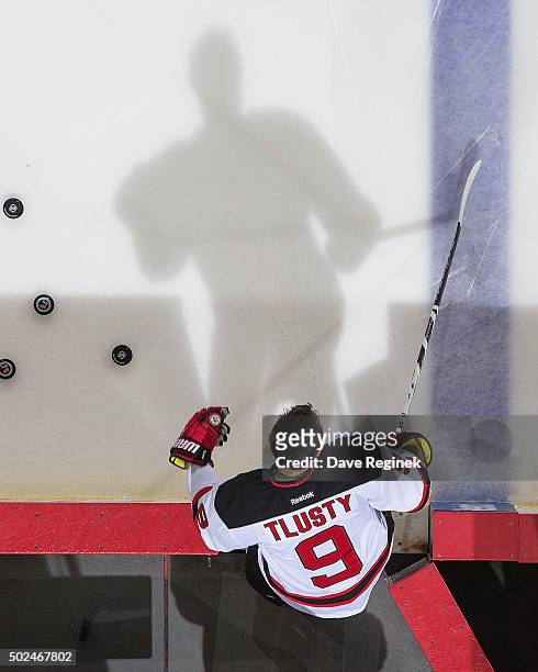 Jiri Tlusty of the New Jersey Devils steps onto the ice during warm-ups before an NHL game against the Detroit Red Wings at Joe Louis Arena on...