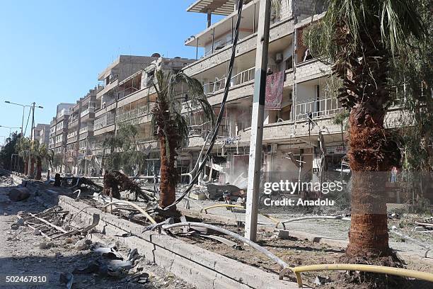 Debris of a collapsed buildings are seen after Russian army carried out airstrike to eastern Ghouta in Damascus, Syria on December 25, 2015.