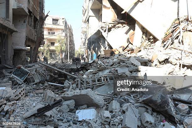 Debris of a collapsed building is seen after Russian army carried out airstrike to eastern Ghouta in Damascus, Syria on December 25, 2015.