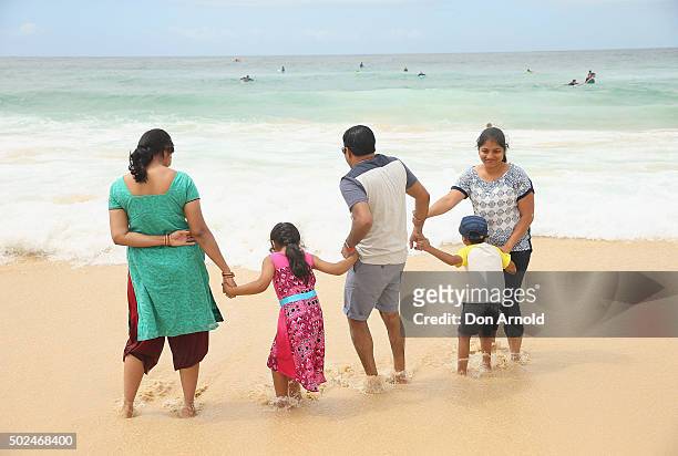 Family is seen playing in the water at Bondi Beach on December 25, 2015 in Sydney, Australia. Bondi Beach is a popular tourist destination on...