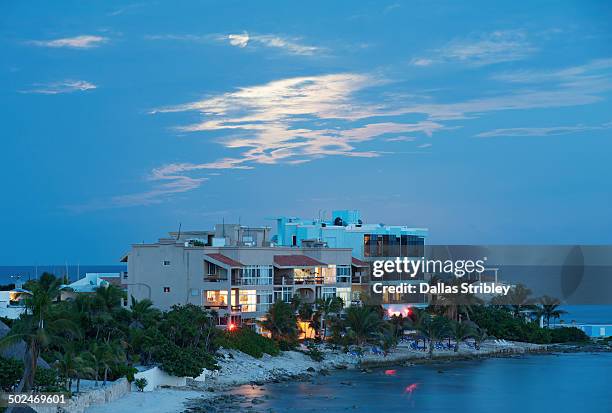 beachfront holiday apartments, under a full moon - mayan riviera stock pictures, royalty-free photos & images