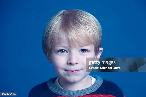 kid cutely smirking at camera - michael virtue stock pictures, royalty-free photos & images