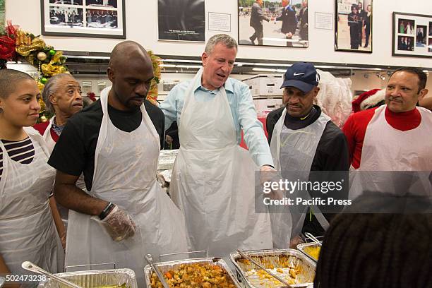 Mayor Bill de Blasio attended the National Action Networks annual Christmas day toy give away & community meal for the hungry. The Mayor & Chiara de...