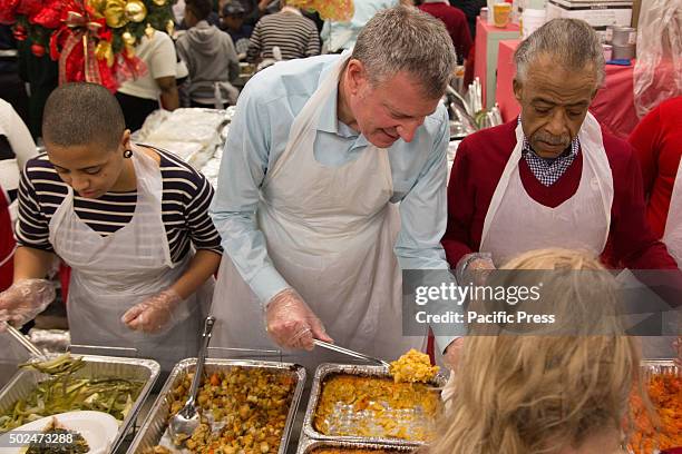 Mayor Bill de Blasio attended the National Action Networks annual Christmas day toy give away & community meal for the hungry. The Mayor & Chiara de...