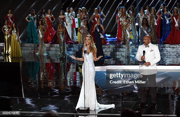 Miss USA 2015, Olivia Jordan , answers a question as host Steve Harvey looks on during the interview portion of the 2015 Miss Universe Pageant at The...