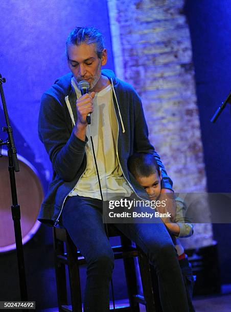 Matisyahu with his son Menachem Mendel Miller performing at City Winery on December 25, 2015 in New York, New York.