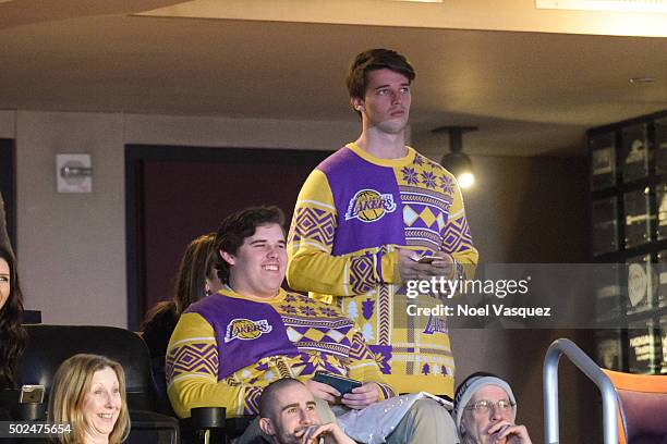 Patrick Schwarzenegger and Christopher Schwarzenegger attend a basketball game between the Los Angeles Clippers and the Los Angeles Lakers at Staples...