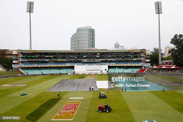 General view as covers remain on the pitch during day one of the 1st Test between South Africa and England at Sahara Stadium Kingsmead on December...