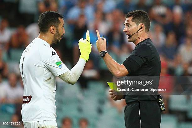 Paul Izzo of the Mariners receives a yellow card from referee Ben Williams during the round 12 A-League match between Sydney FC and the Central Coast...