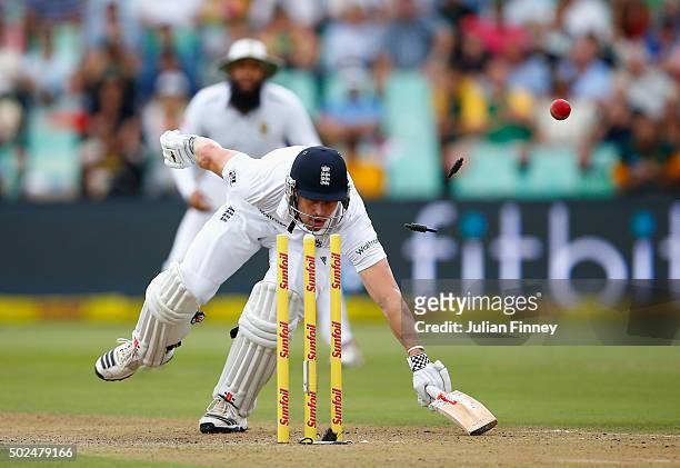 Nick Compton of England just makes it back safe after an attempted run out during day one of the 1st Test between South Africa and England at Sahara...
