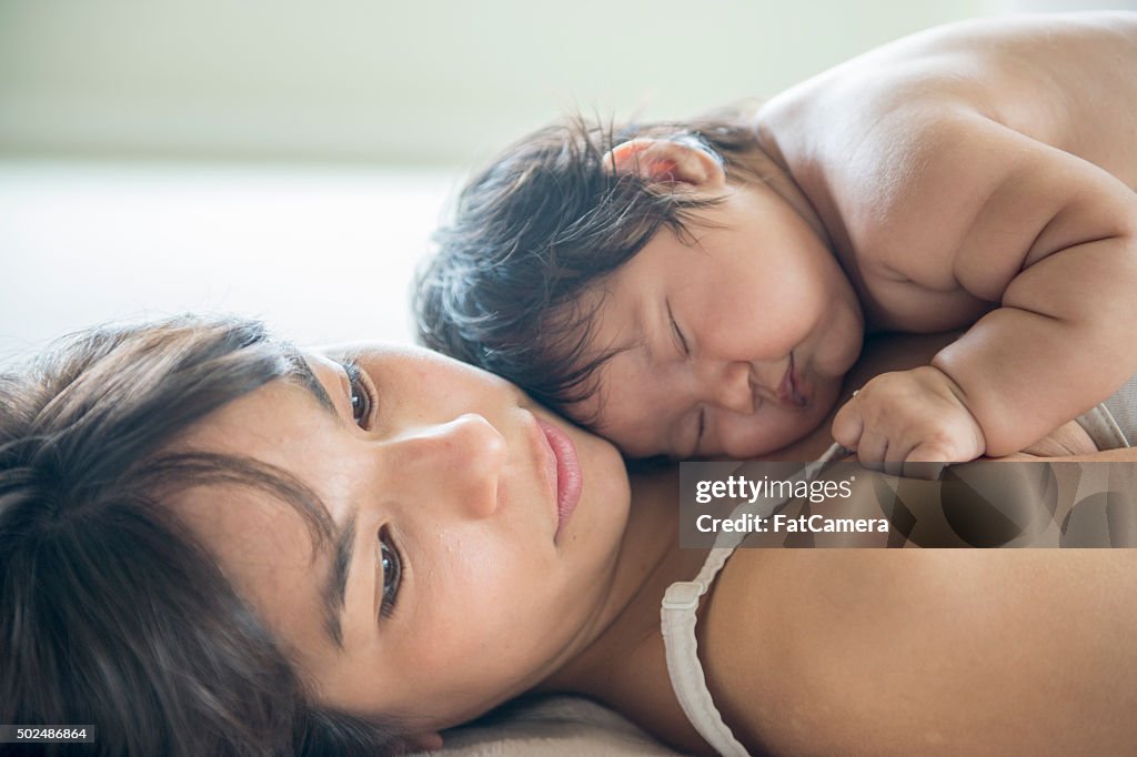 Baby Sleeping on Her Mother's Chest