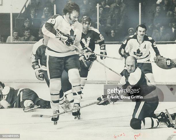 Creating Havog in front of Minnesota North Stars' goal is Maple Leafs' irrepressible Eddie Shack ; who earned star rating for his performace in...