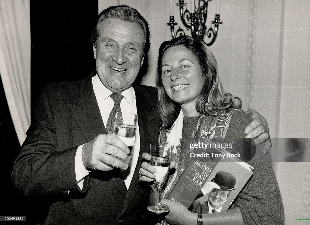 Toast to success: Patrick Macnee and publisher Anna Porter celebrates the launch of the actor's auto