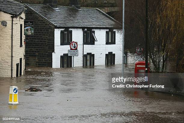 Water rises after the River Calder burst its bank's in the Calder Valley town of Mytholmroyd on December 26, 2015 in Mytholmroyd, England. There are...