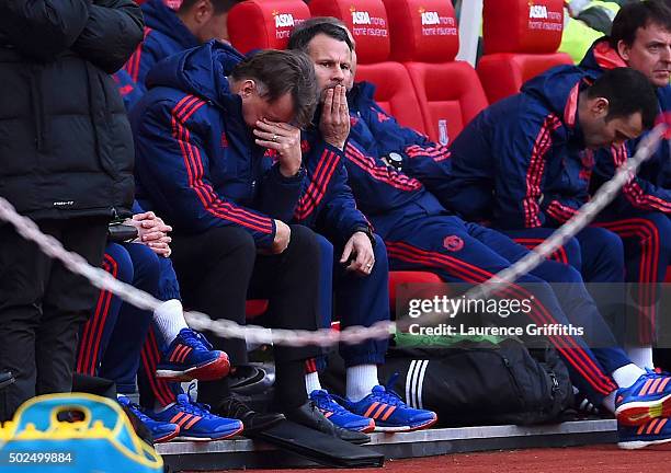 Louis van Gaal, manager of Manchester United reacts on the bench next to his assistant Ryan Giggs during the Barclays Premier League match between...