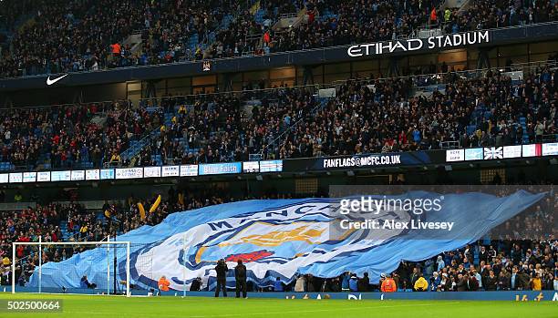 New club badge design is displayed by fans during the Barclays Premier League match between Manchester City and Sunderland at the Etihad Stadium on...