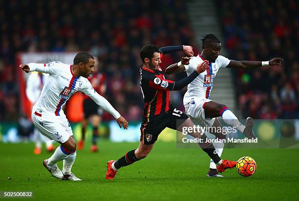 Adam Smith of Bournemouth challenges Pape Souare of Crystal Palace during the Barclays Premier League match between A.F.C. Bournemouth and Crystal...