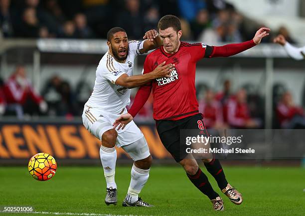 Craig Gardner of West Bromwich Albion is challenged by Ashley Williams of Swansea City during the Barclays Premier League match between Swansea City...